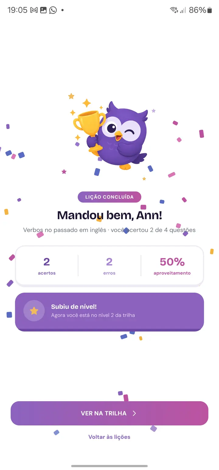 Tela real de conclusão de lição com a mascote Beaky, pontuação e avanço na trilha